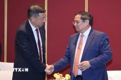 Thủ tướng Phạm Minh Chính tiếp ông Cát Hải Kiều, Chủ tịch Ngân hàng Trung Quốc (BOC). (Ảnh: Dương Giang/TTXVN)