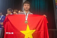 Niềm vui của chàng trai Vàng Olympic Toán học quốc tế Võ Trọng Khải. (Ảnh: TTXVN phát)
