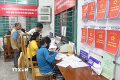 Các địa phương đang triển khai nhiều sáng kiến nhằm phục vụ ngày càng tốt hơn nhu cầu của người dân và doanh nghiệp. (Ảnh: Hồng Hiếu/TTXVN)