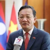 Đại sứ Việt Nam tại Lào Nguyễn Minh Tâm trả lời phỏng vấn. (Ảnh: Xuân Tú/TTXVN)