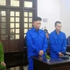 Hai bị cáo tại phiên tòa. (Ảnh: Kim Anh/TTXVN)