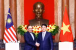 Chủ tịch nước Lương Cường tiếp Thủ tướng Malaysia Anwar Ibrahim. (Ảnh: Lâm Khánh/TTXVN)