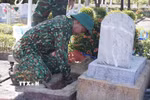 Lấy mẫu ở phần mộ liệt sỹ. (Ảnh minh họa. Nguồn: TTXVN)