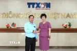 Tổng Giám đốc Thông tấn xã Việt Nam Vũ Việt Trang và ông Vansay Tavinyan, Phó Trưởng Ban Tuyên huấn Trung ương Đảng Nhân dân Cách mạng Lào, Tổng Biên tập Báo Pasaxon (Lào) tại buổi tiếp. (Ảnh: An Đăng/TTXVN)