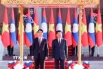 Chủ tịch nước Lương Cường và Tổng Bí thư, Chủ tịch nước Lào Thongloun Sisoulith. (Ảnh: Lâm Khánh/TTXVN)
