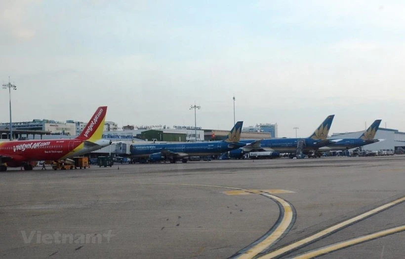 Máy bay của các hãng hàng không Vietnam Airlines và Vietjet. (Ảnh: Việt Hùng/Vietnam+)