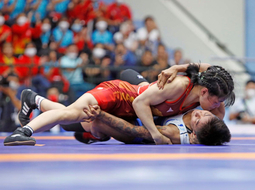 Vận động viên Nguyễn Thị Xuân (áo đỏ). (Ảnh: Trần Việt/TTXVN)