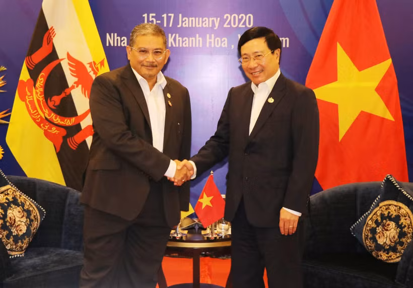 Phó Thủ tướng, Bộ trưởng Ngoại giao Phạm Bình Minh tiếp Bộ trưởng thứ hai Bộ Ngoại giao Brunei Darussalam Dato Erywan Pehin Yusof. (Ảnh: Tiên Minh/TTXVN)