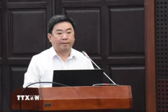 Ông Trần Trung Sơn, Phó Giám đốc Sở Nội vụ, Ủy viên Ủy ban bầu cử thành phố Đà Nẵng phát biểu tại Hội nghị. (Ảnh: Quốc Dũng/TTXVN)
