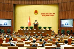 Bộ trưởng Bộ Xây dựng Trần Hồng Minh giải trình, làm rõ một số vấn đề đại biểu Quốc hội nêu. (Ảnh: Doãn Tấn/TTXVN)