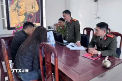 Trường hợp V.X.H làm việc với cơ quan công an. (Ảnh: TTXVN phát)