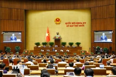 Phó Thủ tướng Chính phủ Lê Thành Long phát biểu giải trình, làm rõ một số vấn đề đại biểu Quốc hội nêu. (Ảnh: Doãn Tấn/TTXVN)