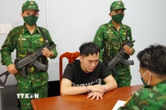 Trương Trọng Hiếu bị bắt giữ tại Đồn Biên phòng Phước Chỉ. (Ảnh: TTXVN phát)