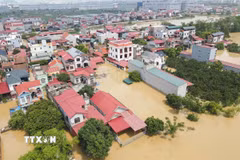 Nhiều khu vực của Bắc Ninh bị nước lũ bủa vây. (Ảnh: Thanh Thương/TTXVN)