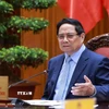 Thủ tướng Phạm Minh Chính chủ trì cuộc họp về triển khai đẩy nhanh tiến độ thực hiện các dự án đường sắt kết nối Việt-Trung. (Ảnh: Dương Giang/TTXVN)