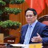 Thủ tướng Phạm Minh Chính chủ trì cuộc họp về triển khai đẩy nhanh tiến độ thực hiện các dự án đường sắt kết nối Việt-Trung. (Ảnh: Dương Giang/TTXVN)