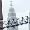 Biển quảng cáo Quỹ đầu tư nhà nước Malaysia (1MDB) bên ngoài một tòa nhà ở Kuala Lumpur, Malaysia, ngày 8/7/2015. (Ảnh: AFP/TTXVN)