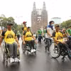 Các vận động viên khuyết tật Thành phố Hồ Chí Minh tham gia Ngày chạy Olympic vì sức khỏe toàn dân. (Ảnh: Thanh Vũ/TTXVN)