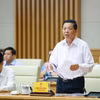 Bộ trưởng Bộ Xây dựng Trần Hồng Minh báo cáo kết quả thực hiện nhiệm vụ của ngành xây dựng. (Ảnh: Dương Giang/TTXVN)