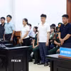 Các bị cáo tại phiên xét xử phúc thẩm. (Ảnh: Phạm Kiên/TTXVN)