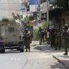 Các lực lượng Israel được triển khai tại thành phố Nablus, Bờ Tây. (Ảnh: THX/TTXVN)