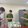 Phòng Cảnh sát Kinh tế triệt phá một đường dây sản xuất, buôn bán thực phẩm chức năng giả. (Ảnh: TTXVN phát)