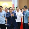 Thủ tướng Phạm Minh Chính đến Hội nghị gặp mặt các doanh nghiệp với chủ đề “80 năm doanh nghiệp đồng hành cùng đất nước.” (Ảnh: Dương Giang/TTXVN)