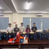 Các đối tượng tại cơ quan công an. (Ảnh: TTXVN phát)