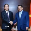 Thủ tướng Phạm Minh Chính tiếp ông Bành Cương Bình, Chủ tịch Hội đồng quản trị Công ty TNHH Tập đoàn Khoa học kỹ thuật Hoa Điện Trung Quốc. (Ảnh: Dương Giang/TTXVN)