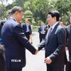 Chủ tịch nước Lương Cường với Tổng Bí thư, Chủ tịch nước Trung Quốc Tập Cận Bình. (Ảnh: Phạm Kiên/TTXVN)