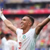 Tiền đạo Soufiane Rahimi ăn mừng sau khi ghi bàn cho Morocco, ấn định tỷ số 3-0 giúp đại diện châu Phi sở hữu tấm vé vào tứ kết. (Ảnh: AFP/TTXVN)