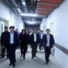 Đoàn kiểm tra tiến độ Dự án cơ sở 2 các Bệnh viện Bạch Mai và Việt Đức (Ảnh: Tuấn Anh/TTXVN)