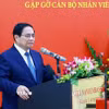 Thủ tướng Phạm Minh Chính phát biểu tại buổi gặp cán bộ, nhân viên, Đại sứ quán và đại diện cộng đồng người Việt Nam tại Malaysia. (Ảnh: Dương Giang/TTXVN)