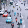 Xe điện với nhiều ưu điểm, tiện lợi nên ngày càng hiện diện nhiều trong đời sống hàng ngày của người dân. (Ảnh: Hoàng Hiếu/TTXVN)
