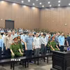 Các bị cáo nghe Tòa tuyên án. (Ảnh: Kim Anh/TTXVN)