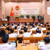 Hội đồng nhân dân thành phố Hà Nội biểu quyết thông qua chương trình kỳ họp. (Ảnh: Văn Điệp/TTXVN)