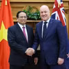 Thủ tướng Phạm Minh Chính với Thủ tướng New Zealand Christopher Luxon. (Ảnh: Dương Giang/TTXVN)