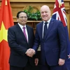 Thủ tướng Phạm Minh Chính với Thủ tướng New Zealand Christopher Luxon. (Ảnh: Dương Giang/TTXVN)