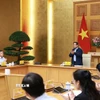 Thủ tướng Phạm Minh Chính chủ trì cuộc họp về phát triển sàn dữ liệu tại Việt Nam. (Ảnh: Dương GiangTTXVN)