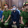 Các bị cáo tại phiên tòa sáng 19/11. (Ảnh: Linh Sơn/TTXVN)