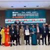 Lãnh đạo tỉnh Quảng Trị và Ban quản lý Vườn quốc gia Phong Nha-Kẻ Bàng đón nhận Giấy chứng nhận Phong Nha-Kẻ Bàng là Khu Dự trữ sinh quyển thế giới. (Ảnh: TTXVN phát)