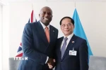 Phó Thủ tướng Bùi Thanh Sơn gặp Phó Thủ tướng, Bộ trưởng Bộ Tư pháp Liên hiệp Vương quốc Anh và Bắc Ireland David Lammy. (Ảnh: Thanh Tuấn/TTXVN)