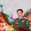Đại tướng Phan Văn Giang, Ủy viên Bộ Chính trị, Phó Bí thư Quân ủy Trung ương, Bộ trưởng Bộ Quốc phòng trình bày Báo cáo chính trị. (Ảnh: Trọng Đức/TTXVN)