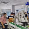 Xưởng thực hành tự động hóa với Robot tại Trung tâm Đào tạo Khu Công nghệ cao Thành phố Hồ Chí Minh. (Ảnh: TTXVN phát)