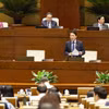 Bộ trưởng Bộ Công an Lương Tam Quang phát biểu giải trình, làm rõ một số vấn đề đại biểu Quốc hội nêu. (Ảnh: Doãn Tấn/TTXVN)