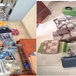 Các sản phẩm thời trang giả mạo nhãn hiệu tại cửa hàng Thanh Hiển Luxury bị tạm giữ. (Ảnh: TTXVN phát)