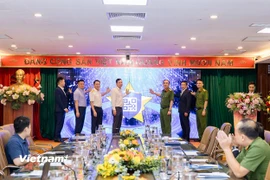 Nghi thức công bố triển khai thí điểm Giải pháp định danh, truy xuất nguồn gốc hoá chất, tiền chất trên nền tảng VNeID. (Ảnh: PV/Vietnam+)