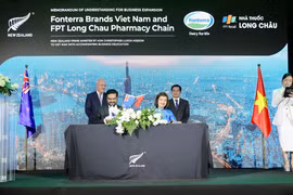 Lễ ký kết của FPT Long Châu và Fonterra Brands Việt Nam ký kết có sư chứng kiến của Thủ tướng New Zeland. (Ảnh: PV/Vietnam+)