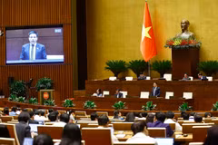 Bộ trưởng Bộ Tài chính Nguyễn Văn Thắng phát biểu giải trình, làm rõ một số vấn đề đại biểu Quốc hội nêu. (Ảnh: TTXVN)