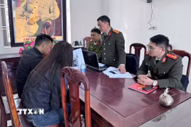 Trường hợp V.X.H làm việc với cơ quan công an. (Ảnh: TTXVN phát)